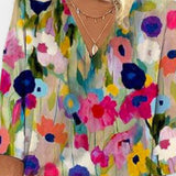 Blusa floreale con scollatura